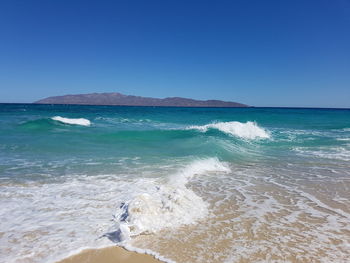 Scenic view of sea against clear blue sky