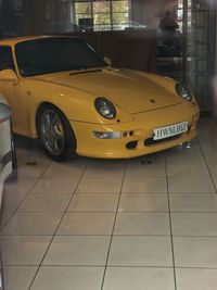 Yellow car in city at night