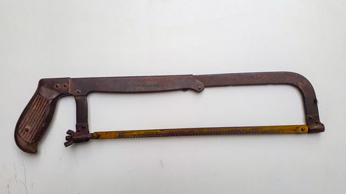 High angle view of tools on table against white background