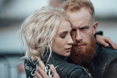 Portrait of young couple outdoors