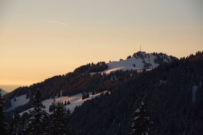 Scenic view of mountains during winter against sky