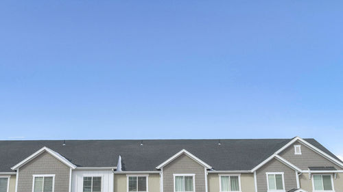 Houses against sky in city