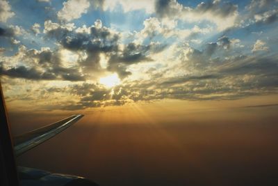 Cropped image of car on road at sunset