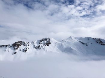 Scenic view of snowcapped mountains against sky