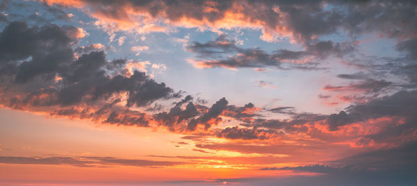 Low angle view of dramatic sky during sunset