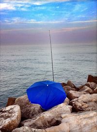 Scenic view of sea against blue sky