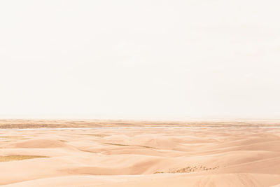 Scenic view of desert against clear sky