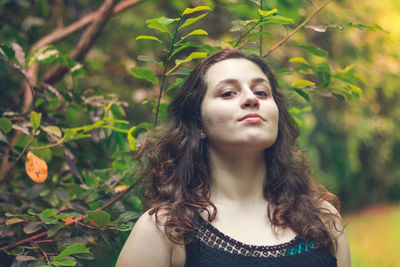 Portrait of smiling teenage girl at park