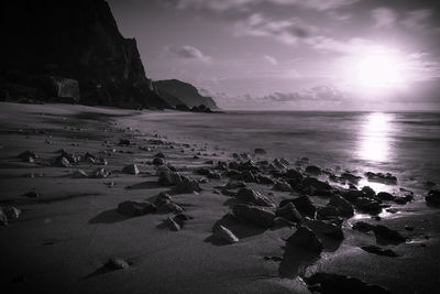 Scenic view of beach against sky during sunset