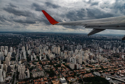 Aerial view of city and buildings against sky