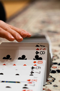 Close-up of hand playing cards