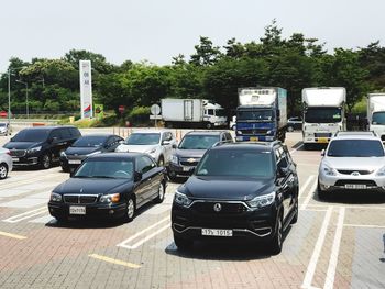 Cars on road against sky