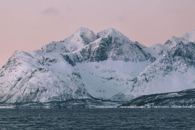 Scenic view of snowcapped mountains against sky during winter