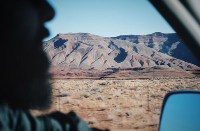 Close-up of mountain road against sky