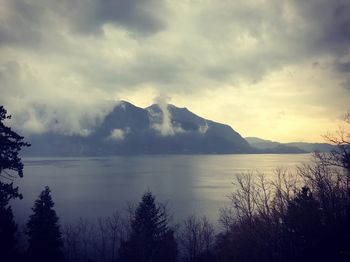 Scenic view of lake against sky during sunset