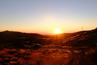 Scenic view of landscape against sky during sunset