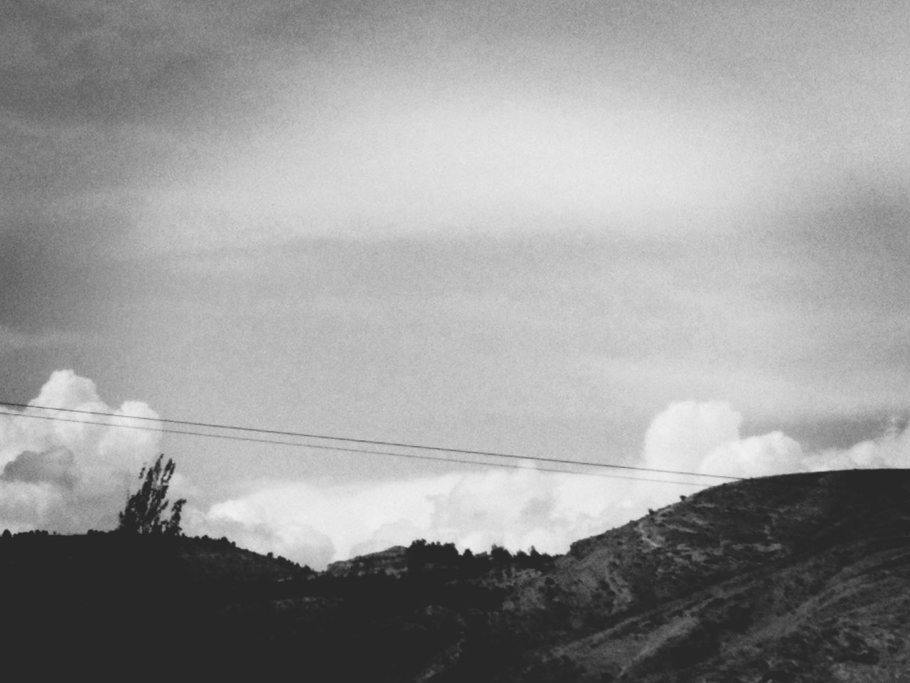 LOW ANGLE VIEW OF VAPOR TRAILS AGAINST SKY