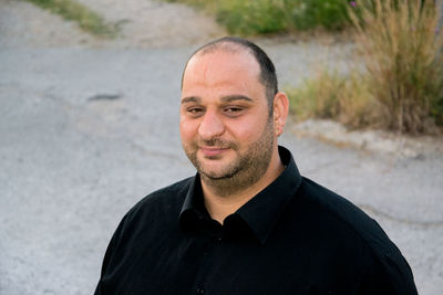 Portrait of man standing outdoors