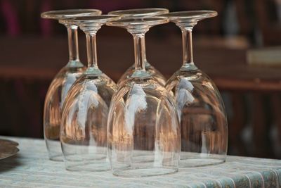 Close-up of wineglasses arranged on table