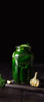 Close-up of fruits in jar on table