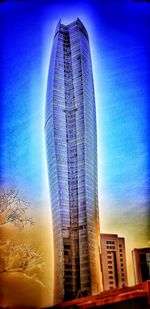 Low angle view of modern buildings against blue sky