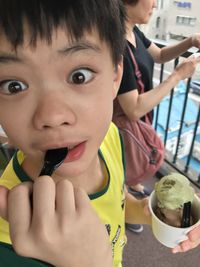 Portrait of boy holding ice cream