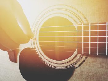 High angle view of guitar on table