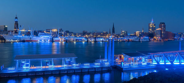 Illuminated city at waterfront