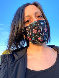 Portrait of woman wearing a mask 