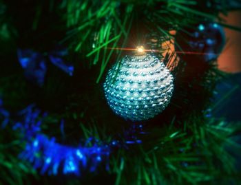 Low angle view of illuminated christmas tree at night