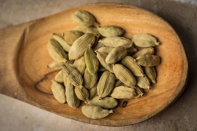 Close-up of cardamoms in spoon