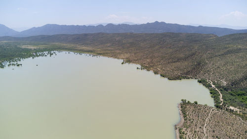 Scenic view of lake and mountains against sky