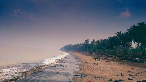 Scenic view of beach against clear sky