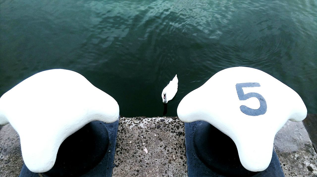 CLOSE-UP OF WATER FLOWING FROM PIPE