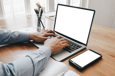 Man using laptop on table