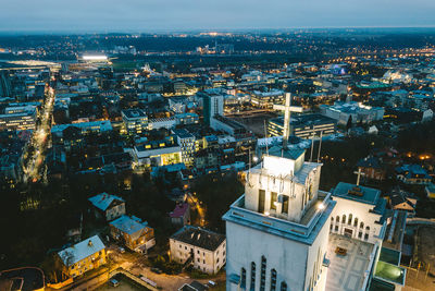 High angle view of illuminated cityscape against sky