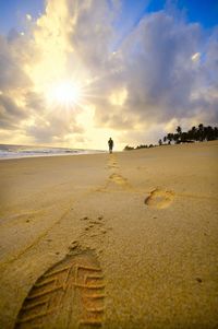 Scenic view of beach against sky during sunset