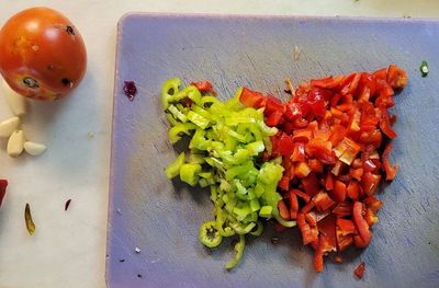 High angle view of chopped fruits in plate on table