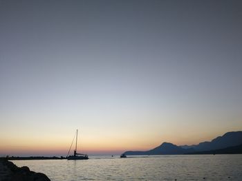 Scenic view of sea against clear sky during sunset