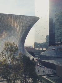 View of bridge in city against sky