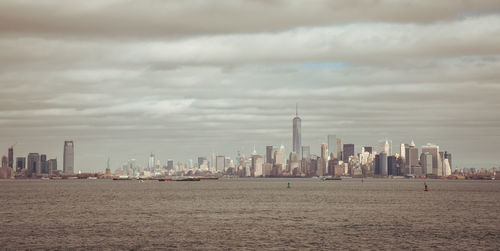 View of downtown manhattan, jersey city and liberty statue.