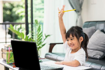 Portrait of girl using mobile phone