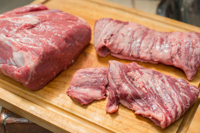 High angle view of meat on cutting board