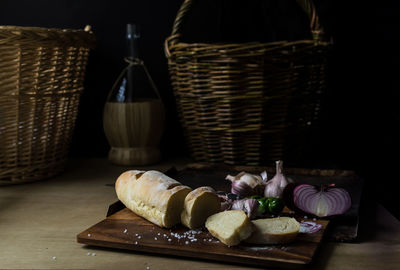 Close-up of food on cutting board against basket