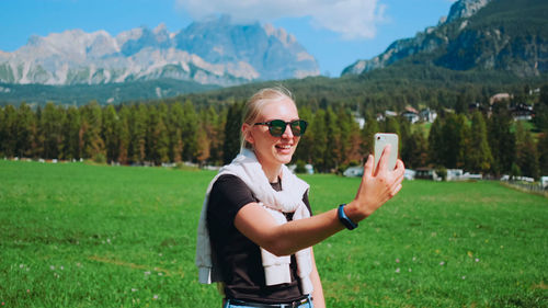 Portrait of young woman using mobile phone