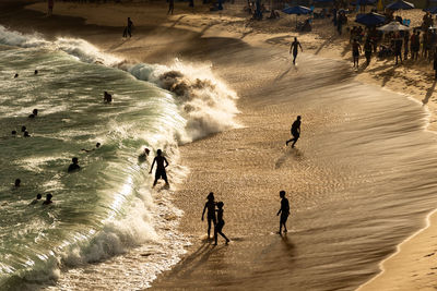 Large group of people on paciencia beach in the rio vermelho neighborhood of salvador, brazil. 