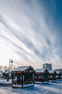 Cozy little vintage wooden houses decorated with new year's toys and garlands. 