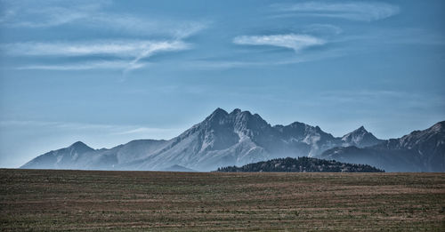 Scenic view of snowcapped mountains against sky