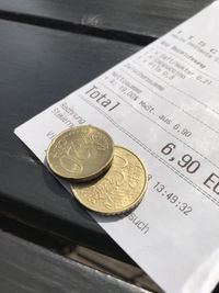 High angle view of coins on table