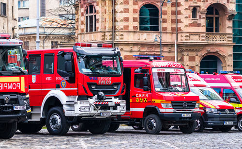 Cars on street against buildings in city